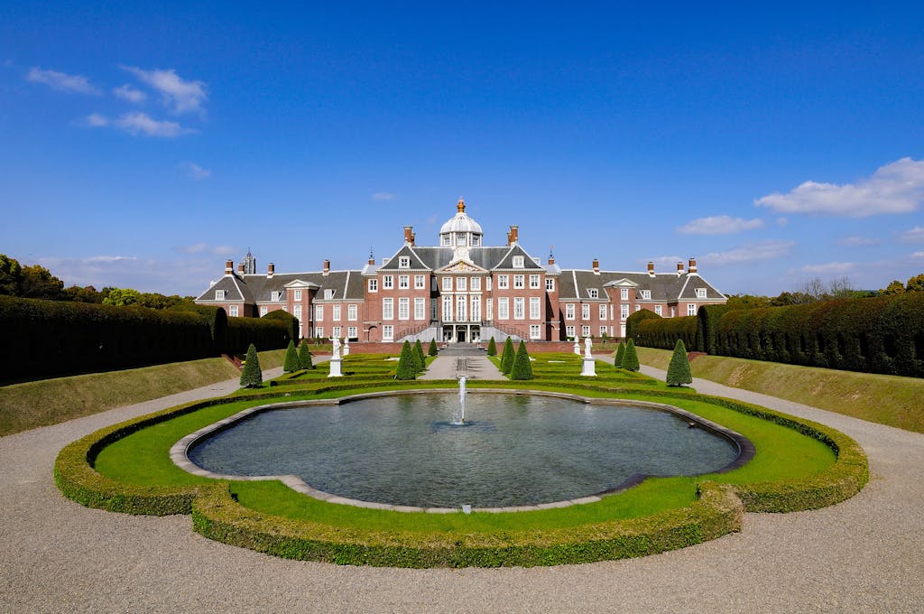Serene view of Huis Ten Bosch Palace and its garden fountain in Japan.