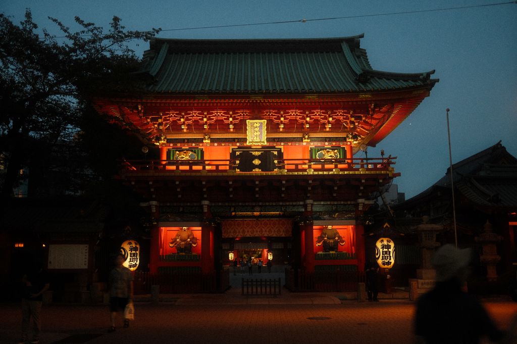 A stunning evening view of Kanda Myojin Shrine's vibrant entrance in Tokyo, Japan.