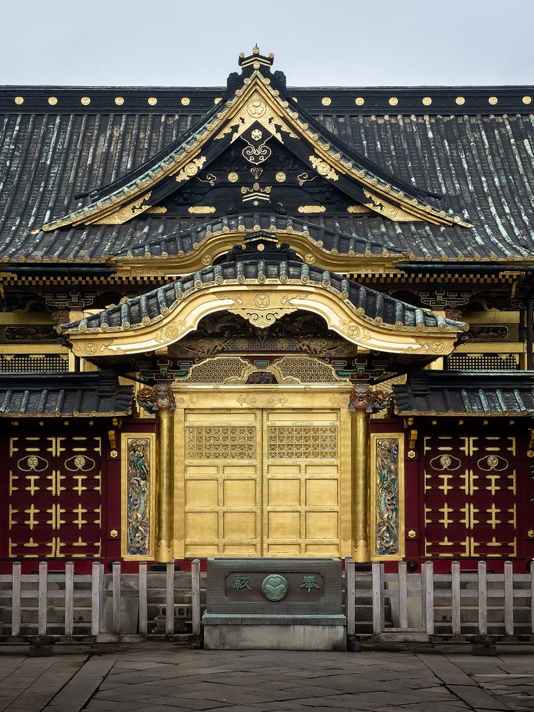 Explore a beautifully ornate traditional shrine entrance in Tokyo, Japan.